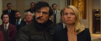 Movie still from “Mortdecai” (2015), directed by David Koepp – A man and a woman standing next to each other; Close Up shot, Low angle