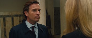 Movie still from “Mortdecai” (2015), directed by David Koepp – A man in a suit and a tie; Close Up shot, Over the shoulder angle