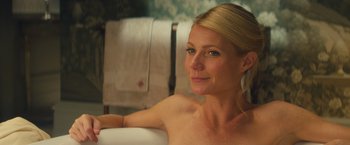 Movie still from “Mortdecai” (2015), directed by David Koepp – A woman sitting in a bath tub in a bathroom; Close Up shot, Over the shoulder angle