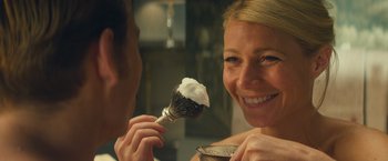 Movie still from “Mortdecai” (2015), directed by David Koepp – A woman holding a shaving brush in her mouth; Close Up shot, Over the shoulder angle