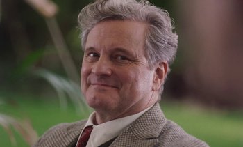 Movie still from “Mothering Sunday” (2021), directed by Eva Husson – An older man wearing a suit and tie; Close Up shot, Over the shoulder angle