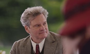 Movie still from “Mothering Sunday” (2021), directed by Eva Husson – An older man in a suit and tie; Close Up shot, Over the shoulder angle