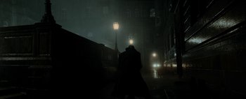 Movie still from “Mr. Jones” (2019), directed by Agnieszka Holland – A person walking down the street in the dark; Wide shot, Low angle