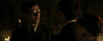 Movie still from “Mr. Jones” (2019), directed by Agnieszka Holland – A man in a suit talking to another man in a suit; Close Up shot, Over the shoulder angle