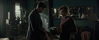 Movie still from “Mr. Jones” (2019), directed by Agnieszka Holland – A man and a woman standing next to each other in a room; Medium shot, Over the shoulder angle