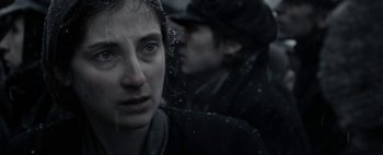 Movie still from “Mr. Jones” (2019), directed by Agnieszka Holland – A woman in a black jacket and a man in a black hat; Close Up shot, Over the shoulder angle