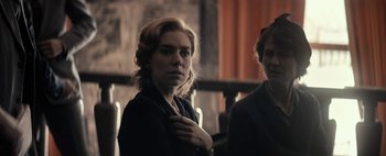 Movie still from “Mr. Jones” (2019), directed by Agnieszka Holland – A woman in a black jacket and a man in a black suit; Medium shot, Over the shoulder angle