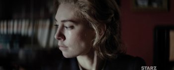 Movie still from “Mr. Jones” (2019), directed by Agnieszka Holland – A person's face in a dark room; Close Up shot, Low angle