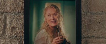 Movie still from “Mamma Mia! Here We Go Again” (2018), directed by Ol Parker – A person with long blonde hair; Close Up shot, Low angle
