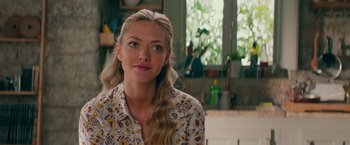 Movie still from “Mamma Mia! Here We Go Again” (2018), directed by Ol Parker – A person with long blonde hair; Close Up shot, Over the shoulder angle