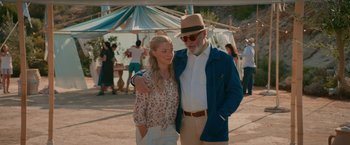 Movie still from “Mamma Mia! Here We Go Again” (2018), directed by Ol Parker – An older man standing next to a young woman; Medium shot, Over the shoulder angle