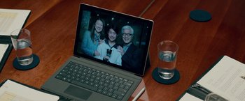 Movie still from “Mamma Mia! Here We Go Again” (2018), directed by Ol Parker – An image of two people and an old man on a laptop; Close Up shot, Overhead angle