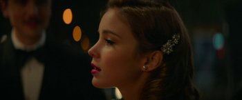 Movie still from “Mrs. Harris Goes to Paris” (2022), directed by Anthony Fabian – A person wearing a hair clip; Close Up shot, Over the shoulder angle