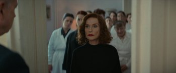 Movie still from “Mrs. Harris Goes to Paris” (2022), directed by Anthony Fabian – A group of women standing next to each other in a room; Medium shot, Over the shoulder angle