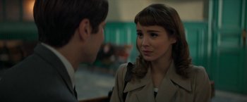 Movie still from “Mrs. Harris Goes to Paris” (2022), directed by Anthony Fabian – A man and a woman talking to each other; Close Up shot, Over the shoulder angle