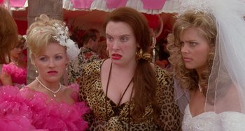 Movie still from “Muriel's Wedding” (1994), directed by P.J. Hogan – A group of women standing next to each other; Close Up shot, Over the shoulder angle