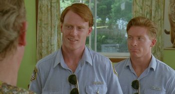Movie still from “Muriel's Wedding” (1994), directed by P.J. Hogan – A man in a blue shirt and a man in a blue shirt; Close Up shot, High angle