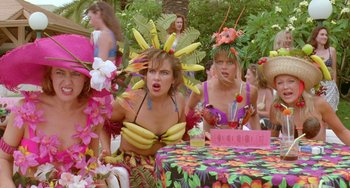 Movie still from “Muriel's Wedding” (1994), directed by P.J. Hogan – A group of women dressed up in costumes and hats; Medium shot, High angle