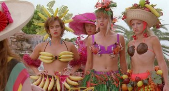 Movie still from “Muriel's Wedding” (1994), directed by P.J. Hogan – A group of women wearing costumes of bananas and other fruits; Medium shot, Low angle