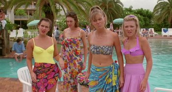 Movie still from “Muriel's Wedding” (1994), directed by P.J. Hogan – A group of young women standing next to each other; Medium shot, High angle