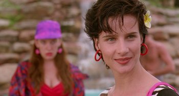 Movie still from “Muriel's Wedding” (1994), directed by P.J. Hogan – A woman in a purple hat and a woman in a red hat; Close Up shot, Over the shoulder angle