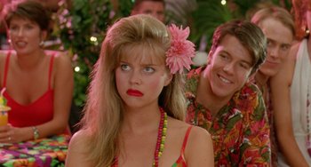 Movie still from “Muriel's Wedding” (1994), directed by P.J. Hogan – A woman with a flower in her hair and a man with a flower in his hair; Close Up shot, Over the shoulder angle