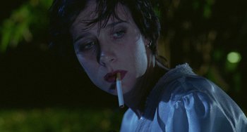 Movie still from “Muriel's Wedding” (1994), directed by P.J. Hogan – A woman with a cigarette in her mouth; Close Up shot, Low angle