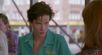 Movie still from “Muriel's Wedding” (1994), directed by P.J. Hogan – A person wearing a green shirt; Close Up shot, Low angle