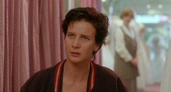 Movie still from “Muriel's Wedding” (1994), directed by P.J. Hogan – A person with short hair; Close Up shot, Over the shoulder angle