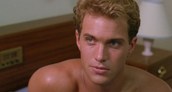 Movie still from “Muriel's Wedding” (1994), directed by P.J. Hogan – A man with a blue eye; Close Up shot, Over the shoulder angle