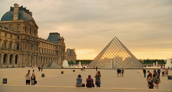 Movie still from “Midnight in Paris” (2011), directed by Woody Allen – A group of people sitting in front of a building; Extreme Wide shot, Low angle