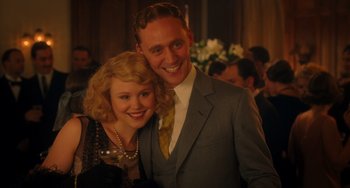 Movie still from “Midnight in Paris” (2011), directed by Woody Allen – A man and a woman posing for a picture; Medium shot, Over the shoulder angle