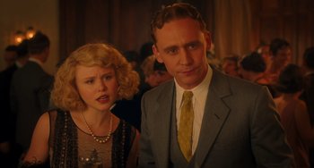 Movie still from “Midnight in Paris” (2011), directed by Woody Allen – A man and a woman standing next to each other; Medium shot, Over the shoulder angle