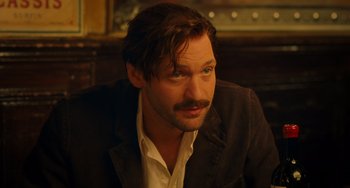 Movie still from “Midnight in Paris” (2011), directed by Woody Allen – A person wearing a jacket; Close Up shot, Over the shoulder angle