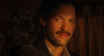 Movie still from “Midnight in Paris” (2011), directed by Woody Allen – A person with a mustache; Close Up shot, Low angle