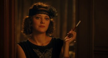 Movie still from “Midnight in Paris” (2011), directed by Woody Allen – A beautiful young lady holding a toothbrush in her right hand; Close Up shot, Over the shoulder angle