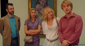 Movie still from “Midnight in Paris” (2011), directed by Woody Allen – A group of people standing next to each other in front of a painting; Medium shot, Over the shoulder angle