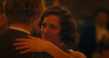 Movie still from “Midnight in Paris” (2011), directed by Woody Allen – A man and a woman embracing each other in a dark room; Close Up shot, Over the shoulder angle