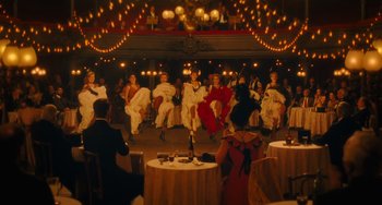 Movie still from “Midnight in Paris” (2011), directed by Woody Allen – A group of people dancing on a dance floor; Wide shot, High angle