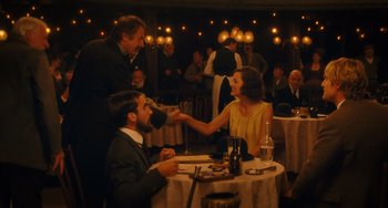 Movie still from “Midnight in Paris” (2011), directed by Woody Allen – A man and a woman at a dinner table; Wide shot, Over the shoulder angle