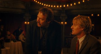 Movie still from “Midnight in Paris” (2011), directed by Woody Allen – A man and a woman are talking in a room; Medium shot, Over the shoulder angle