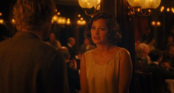 Movie still from “Midnight in Paris” (2011), directed by Woody Allen – A woman in a white dress standing next to a man; Close Up shot, Over the shoulder angle