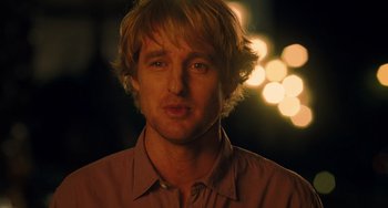 Movie still from “Midnight in Paris” (2011), directed by Woody Allen – A person wearing a brown shirt; Close Up shot, Over the shoulder angle