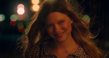 Movie still from “Midnight in Paris” (2011), directed by Woody Allen – A woman with long brown hair smiles for the camera; Close Up shot, Over the shoulder angle