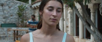Movie still from “Murina” (2021), directed by Antoneta Alamat Kusijanovic – A young woman is looking down at her face; Close Up shot, High angle