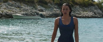 Movie still from “Murina” (2021), directed by Antoneta Alamat Kusijanovic – A woman in a blue bathing suit standing in the water; Medium shot, Low angle
