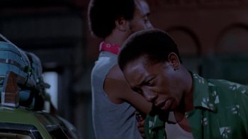 Movie still from “Vacation” (1983), directed by Harold Ramis – Two men standing next to each other in a room; Close Up shot, Low angle