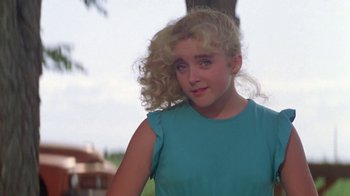 Movie still from “Vacation” (1983), directed by Harold Ramis – A young woman with blonde hair and a blue shirt; Close Up shot, Low angle