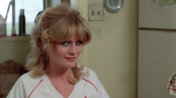 Movie still from “Vacation” (1983), directed by Harold Ramis – A person wearing a white shirt; Close Up shot, Over the shoulder angle