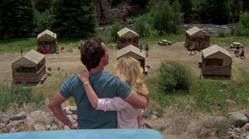 Movie still from “Vacation” (1983), directed by Harold Ramis – A man and a woman standing next to each other in a field; Wide shot, Low angle